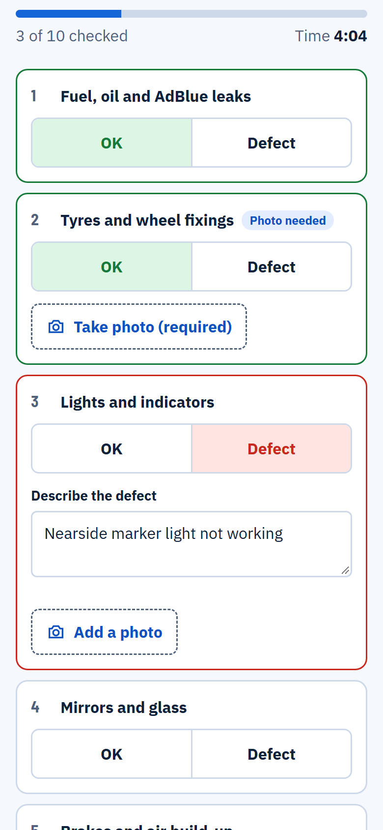 A walkaround check in progress: each item marked OK or Defect, with photos and a timer.